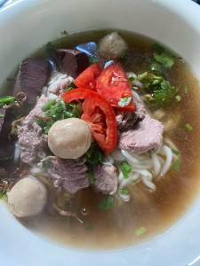 Ms. Lae noodle soup and minced meat salad